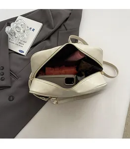 Top view of spacious cream Boston bag showing interior capacity for daily essentials