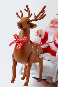 Close-up of electric Santa sleigh with reindeer, festive Christmas tabletop decoration