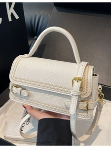 Minimalist white litchi leather square handbag with golden hardware and long strap