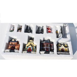 Christmas Village set with 4 LED glowing houses, Santa, pine trees, and accessories