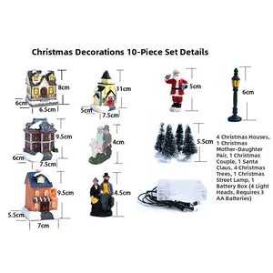 Close-up of 10-piece LED Christmas village set with resin houses and snowy trees