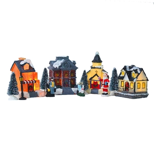 LED lighted Christmas village set with miniature houses trees and figurines for holiday decor