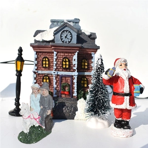 Detailed Christmas village set with resin red brick house, Santa, and snowy pine trees