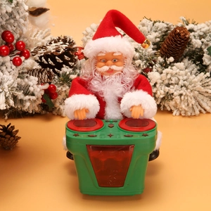 Electric musical Santa Claus toy playing drums with festive green base and warm background