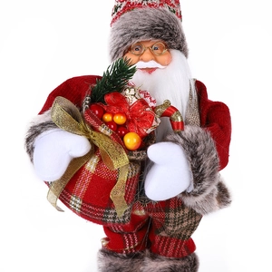 Close-up of Santa Claus doll with gold glasses and festive gift bag detail