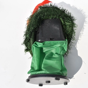 Detail of the electric Christmas doll featuring the battery compartment and power switch
