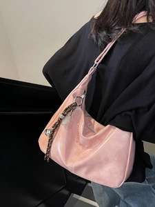 Pink large capacity hobo tote bag in glossy metallic finish with a braided strap detail
