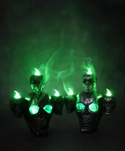 Detail of Halloween skull LED light featuring eerie green eyes and smoke effect function