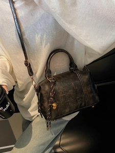 Retro black leather Boston bag with vintage texture and adjustable strap