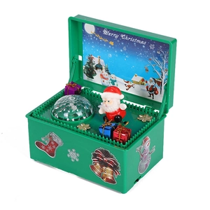 Detail of a musical box with a rotating Santa Claus and a glowing disco ball