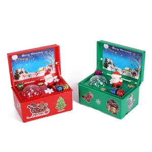 Electric Christmas music box set with climbing Santa Claus and glowing holiday decorations