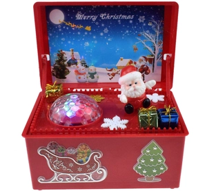 Detail of a red Christmas music box with rotating Santa Claus and LED glowing crystal lights