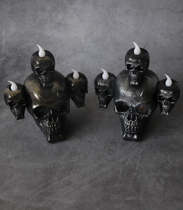 Dual bronze and silver skull LED candle holders for Halloween haunted house decor