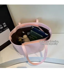 Pink leather tote bag detail with large capacity interior and secure zipper pocket