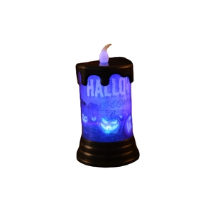 Candela LED di Halloween con luce blu e design a zucca spaventosa su base nera