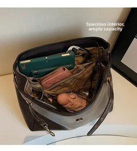 Detailed interior of vintage brown tote bag showing large capacity and striped lining