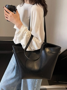 Minimalist black faux leather tote bag with large capacity for commuting and daily use