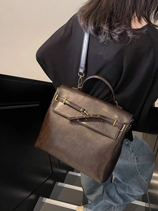 Vintage dark brown faux leather backpack for women with gold buckle and top handle