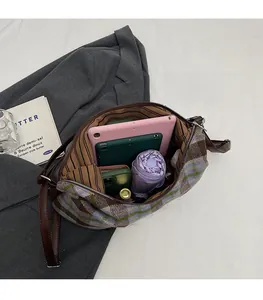 Large capacity checkered tote bag showing spacious interior with tablets and umbrella