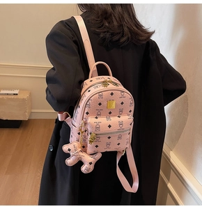 Detail view of pink mini backpack with Teddy Bear print and cute bear keychain charm