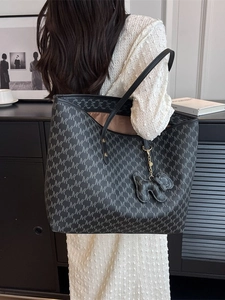Classic monogram tote bag in charcoal leather with top handles and elephant charm