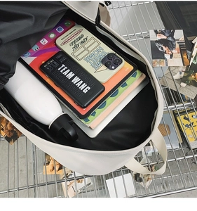 Internal view of the large capacity beige backpack with compartments for tablets and books