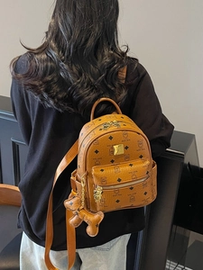 Mini cognac backpack with teddy bear monogram print and matching charm accessory
