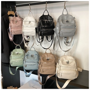 Detailed view of casual PU leather backpacks in 8 colors with multi-layer zipper pockets