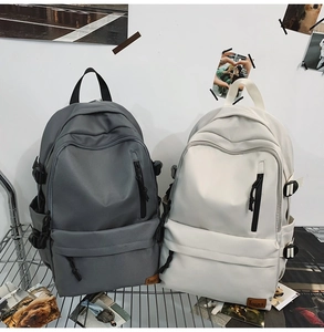 Close-up of minimalist backpack with TENGRUN logo, multiple pockets, and waterproof fabric
