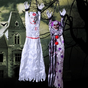 Detailed view of hanging nurse and clown ghost props with chains for Halloween decor