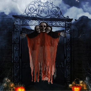 Detail of three-headed Halloween hanging ghost with orange mesh and skeleton hands