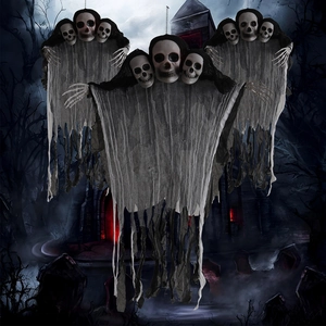Detailed view of large three-headed Halloween hanging skull ghosts with tattered gray gauze