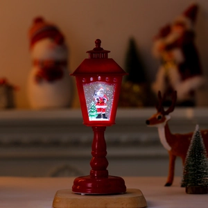 Red Christmas lantern lamp with glowing Santa scene and swirling snowflake glitter