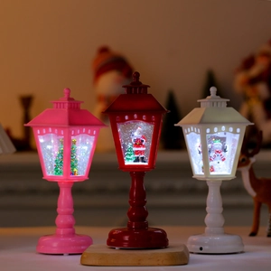 Vintage style Christmas LED lanterns with miniature Santa, snowman and tree scenes