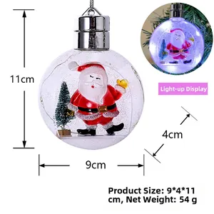 Detailed view of glowing transparent Christmas ball with Santa and dimensions 9x4x11cm
