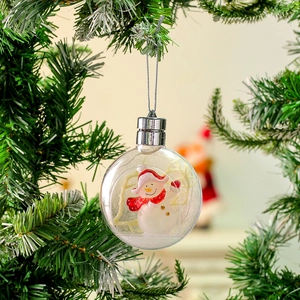 Close-up of a clear 100cm glowing Christmas ball with a snowman inside on a tree
