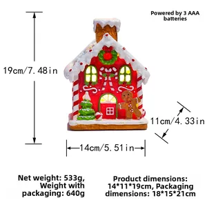 Detail of Christmas gingerbread house with LED lights and holiday figurines