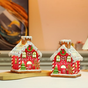 Lighted musical gingerbread house resin ornament with Christmas tree and candy details