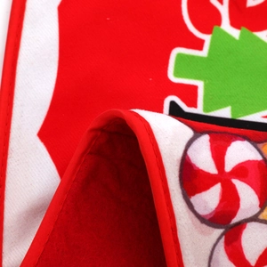 Detail of Christmas tree collar fabric with festive candy cane and tree patterns