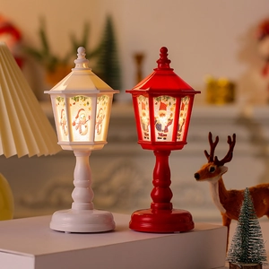 Close-up of retro Christmas lantern set with Santa and snowman patterns in a cozy setting