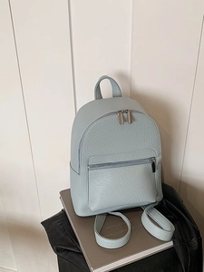 Minimalist light blue pebbled leather mini backpack with metal zippers for women