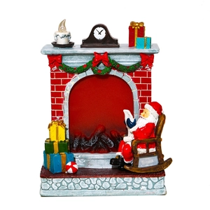 Resin Christmas fireplace figurine with Santa sitting in a rocker and colorful gifts
