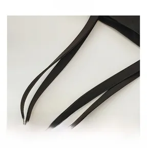 Detail shot of the reinforced black canvas shoulder straps and sturdy stitching on the tote