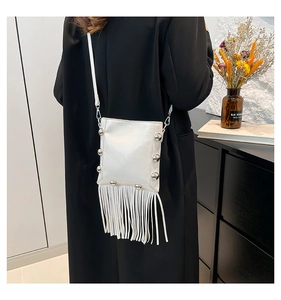 Chic white leather crossbody bag with silver studs and long fringe tassels detail