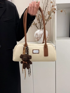 Retro cream white Boston handbag with brown leather handles and plush bear charm