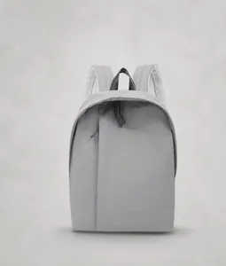 Front view of gray minimalist waterproof nylon backpack featuring vertical hidden zipper