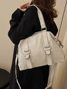 Creamy white large capacity PU leather tote bag shown with a stylish black blazer