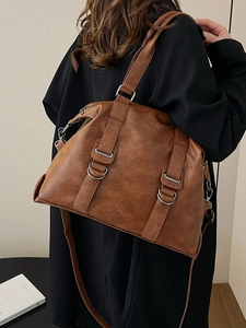 Retro brown PU leather tote bag with adjustable shoulder strap and metal buckle detail