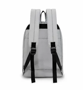 Detail view of the light grey backpack back with wide padded shoulder straps