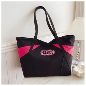 Detail of contrast stitch canvas tote bag with pink logo and large capacity